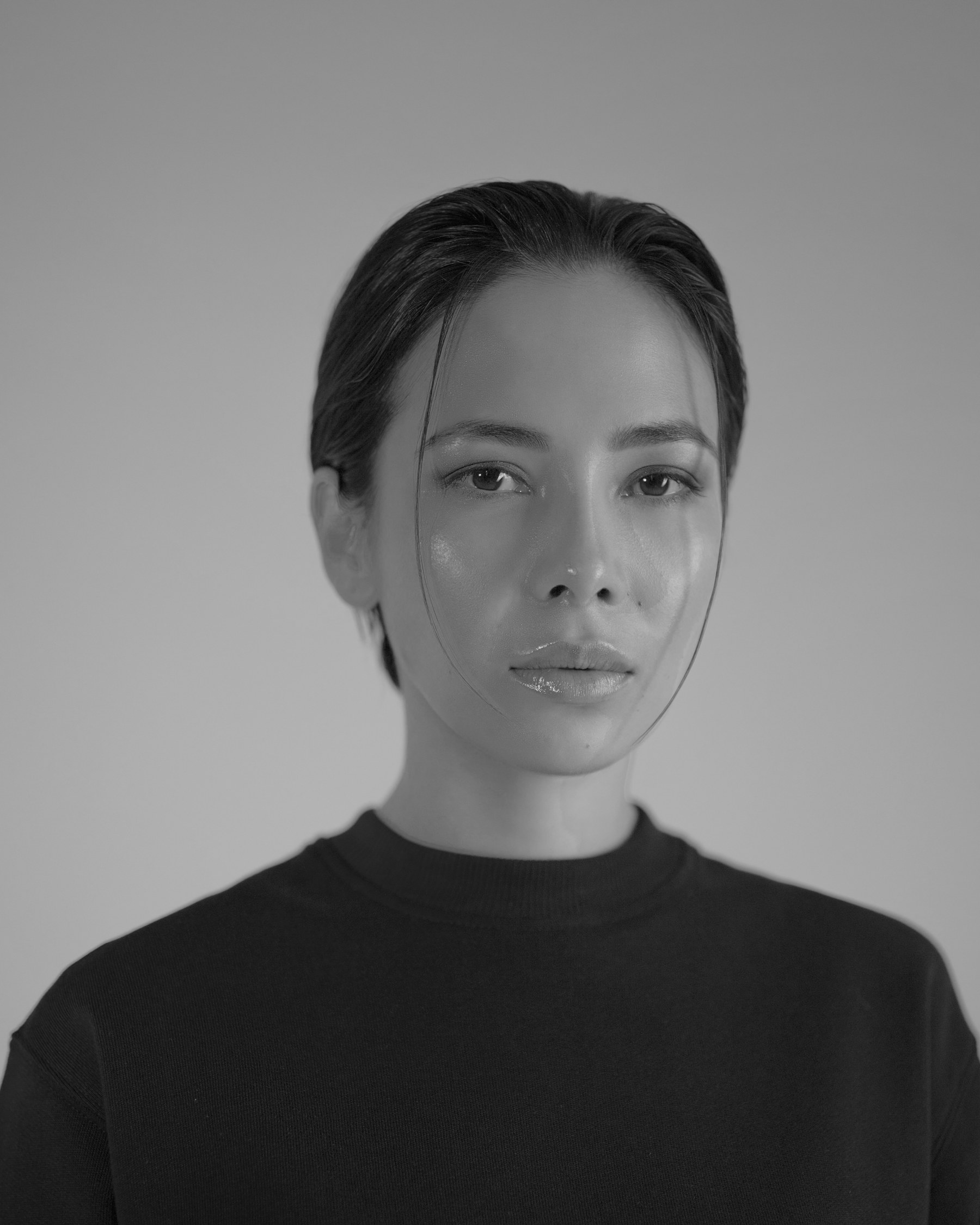 Editorial portrait with dramatic window light